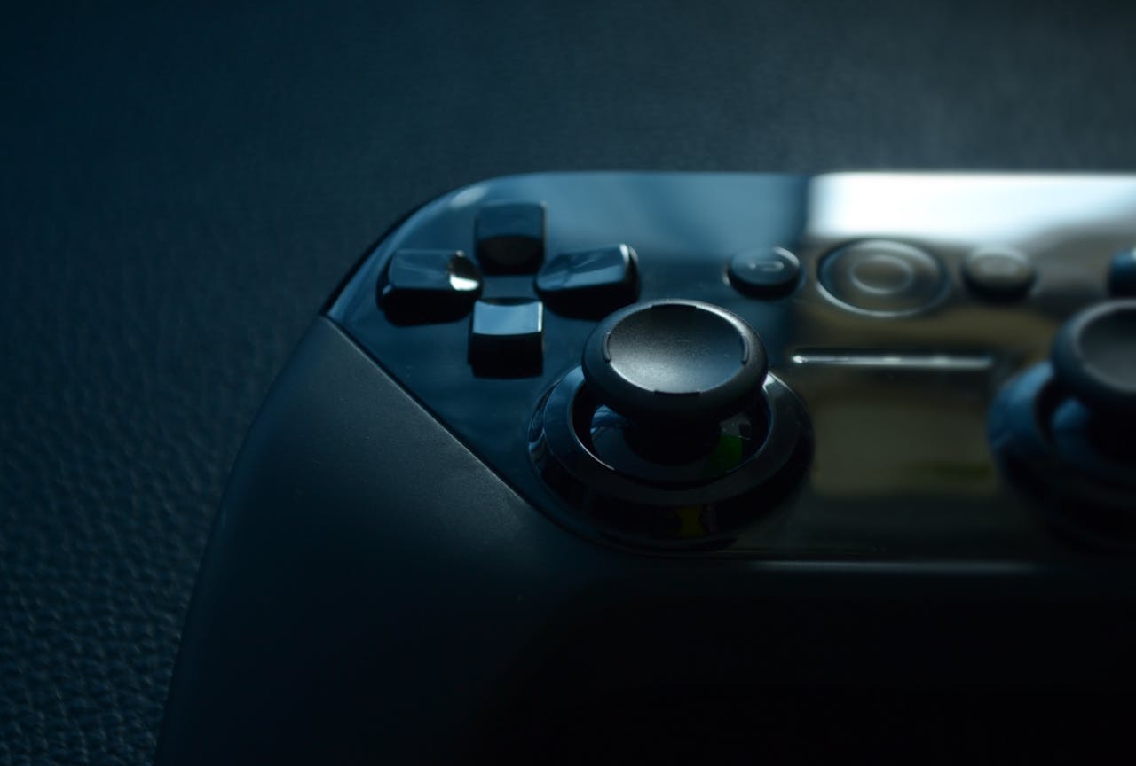A sleek and modern game controller captured in close-up with dramatic lighting, perfect for gaming themes.